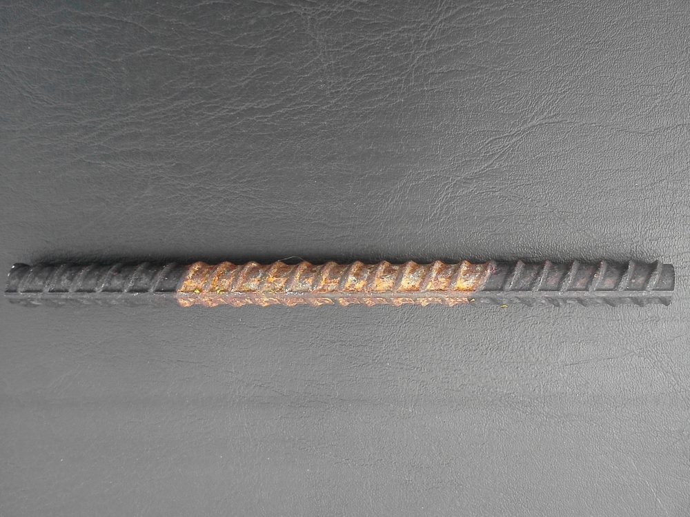 Re-bar photo corrosion inhibitor